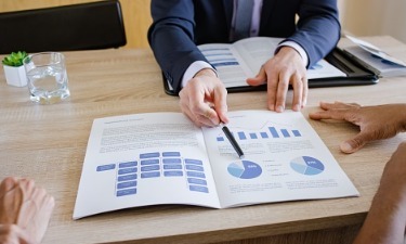 financial advisor showing information to clients